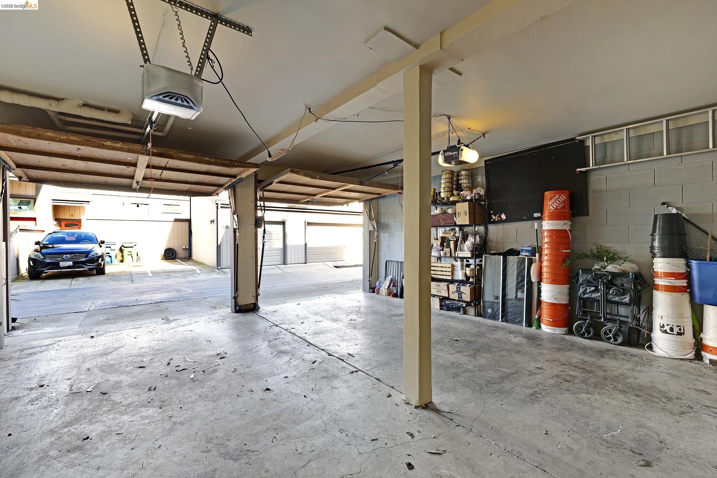 407 Vista Heights Road El Cerrito, CA 94530 - Photo 23 of 29 Garage with concrete block wall and a garage door opener