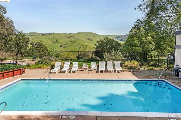 a view of a swimming pool with a mountain