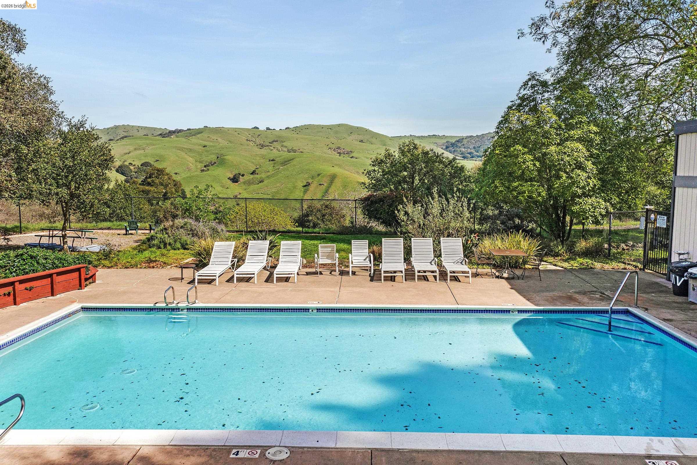 407 Vista Heights Road El Cerrito, CA 94530 - Photo 4 of 29 Community pool featuring a mountain view and a patio area