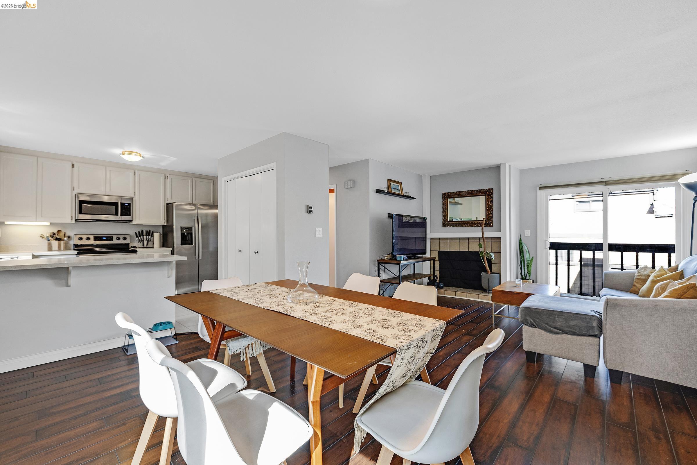 407 Vista Heights Road El Cerrito, CA 94530 - Photo 8 of 29 Dining space with dark wood-style floors and a tile fireplace