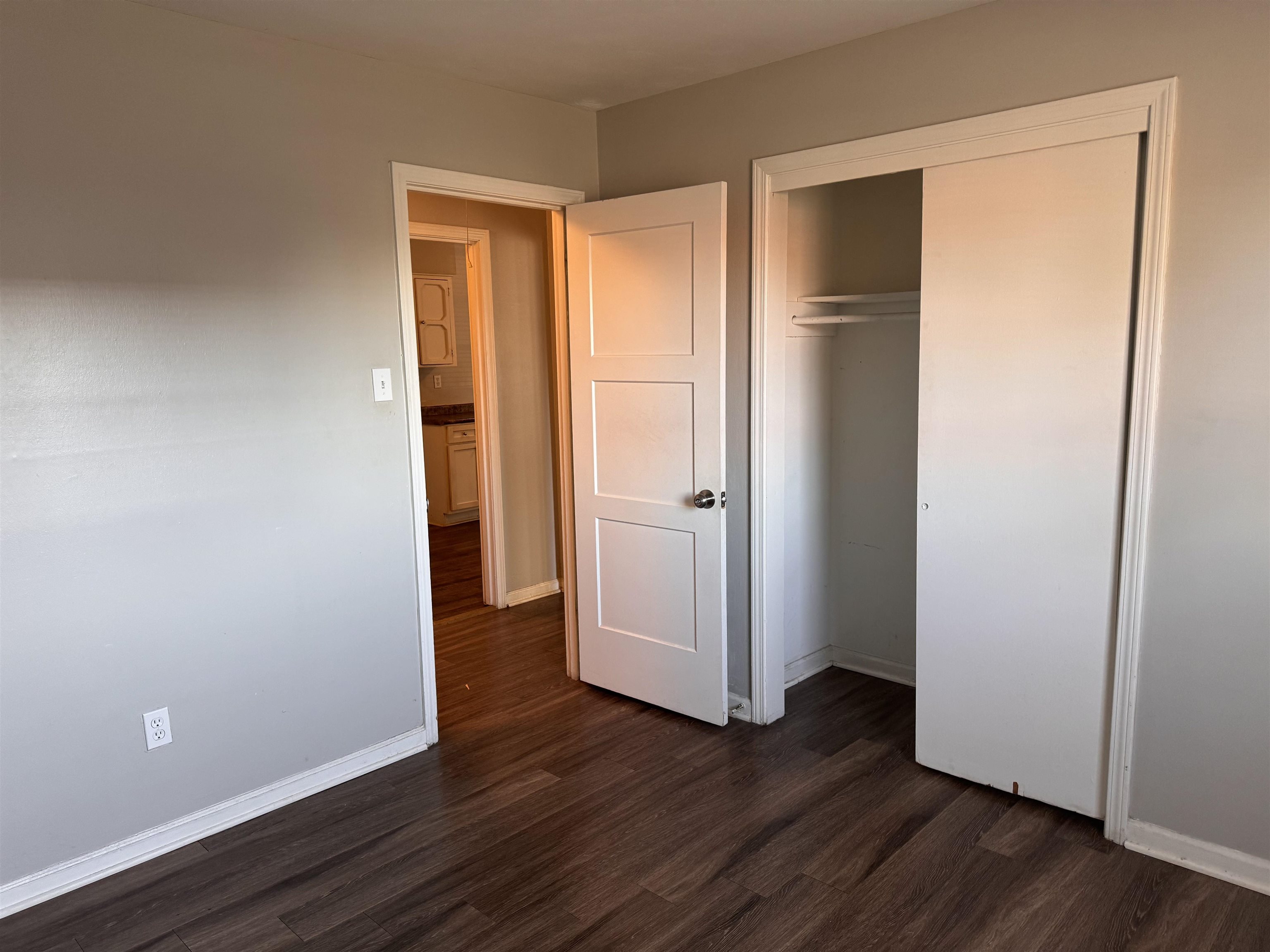 3788 Bishops Bridge Road Memphis, TN 38118 - Photo 12 of 22 a view of an empty room with wooden floor and a window