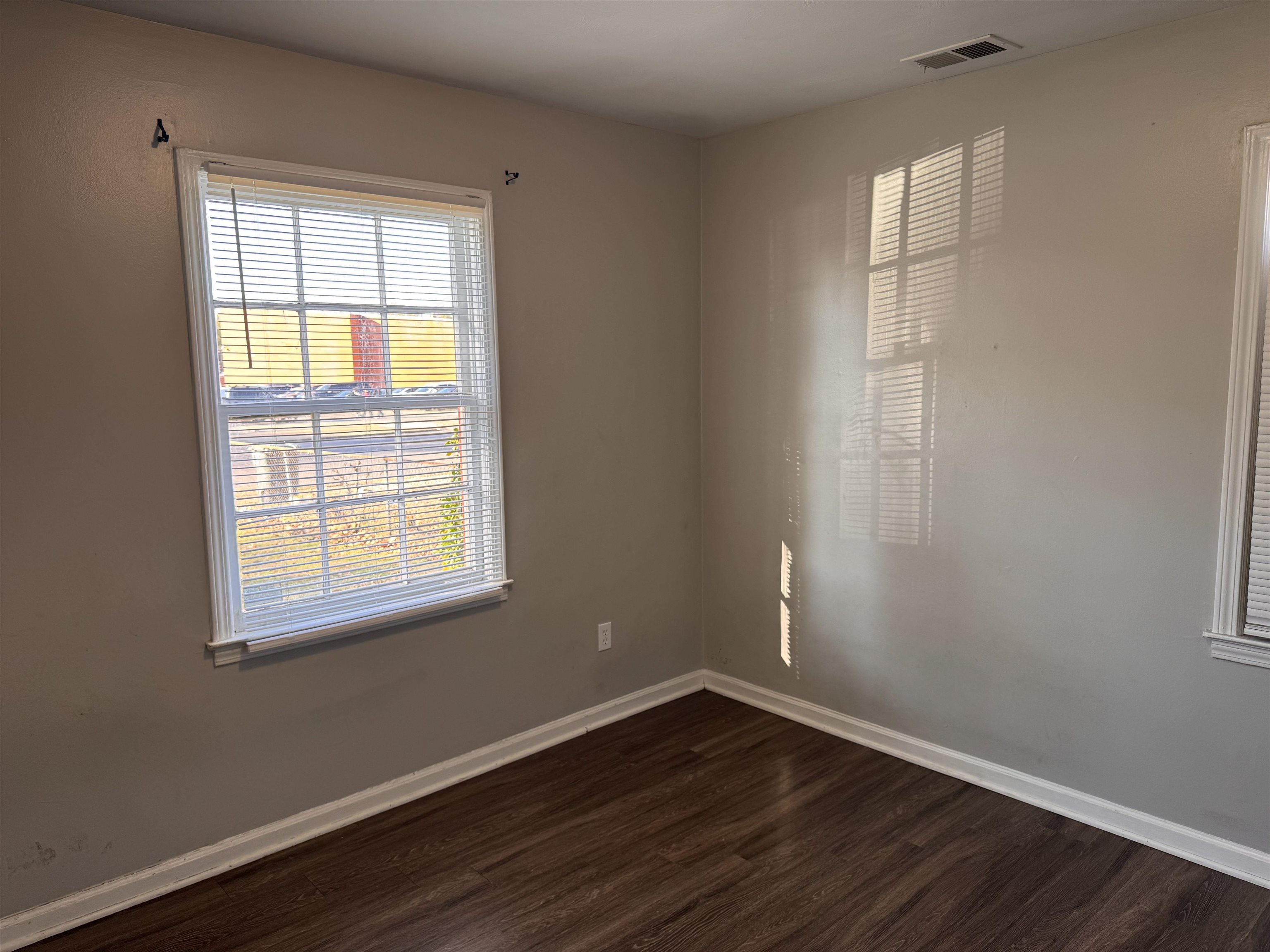 3788 Bishops Bridge Road Memphis, TN 38118 - Photo 16 of 22 an empty room with wooden floor and windows