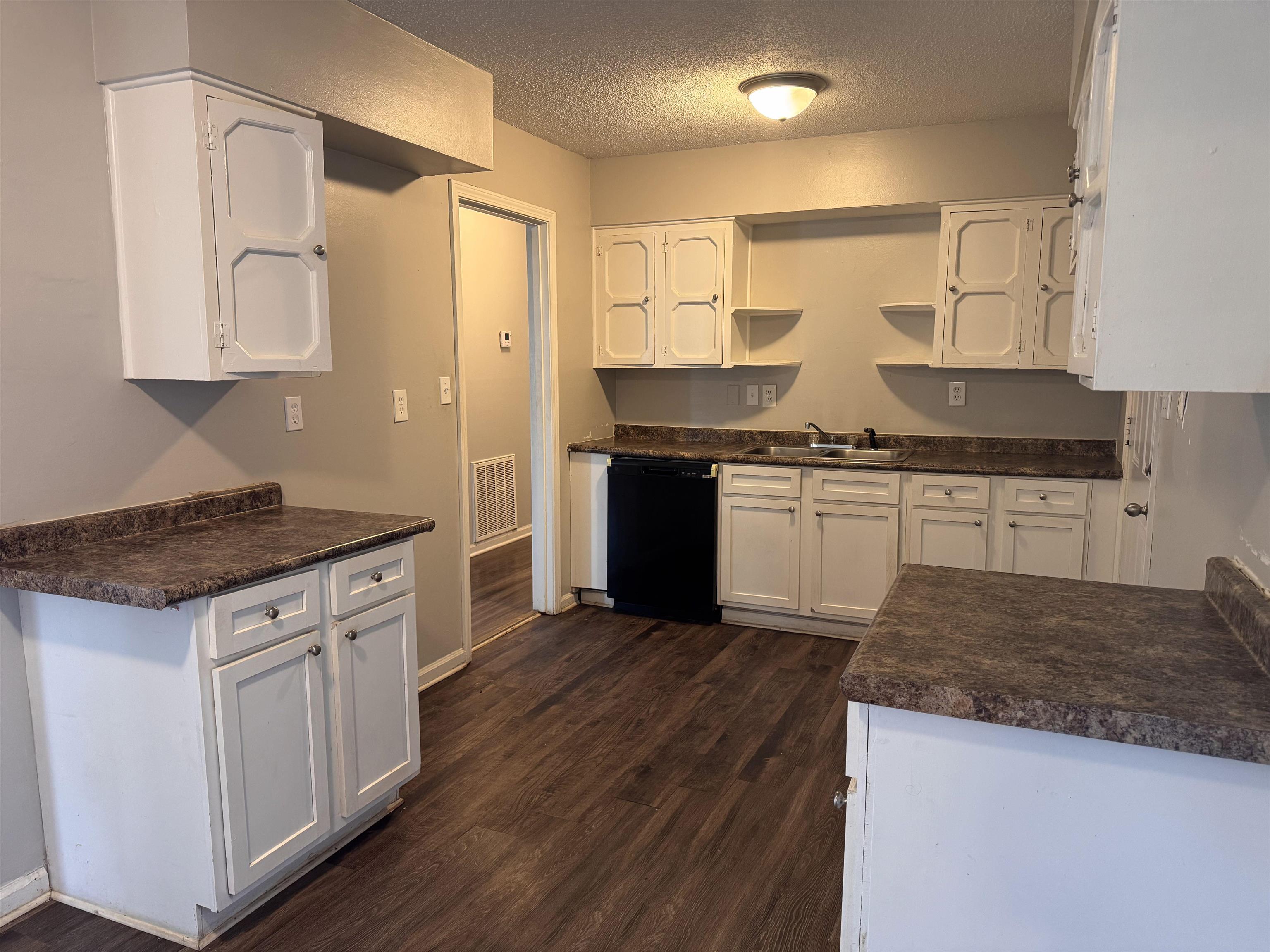 3788 Bishops Bridge Road Memphis, TN 38118 - Photo 5 of 22 a kitchen with stainless steel appliances granite countertop a stove a sink and a refrigerator