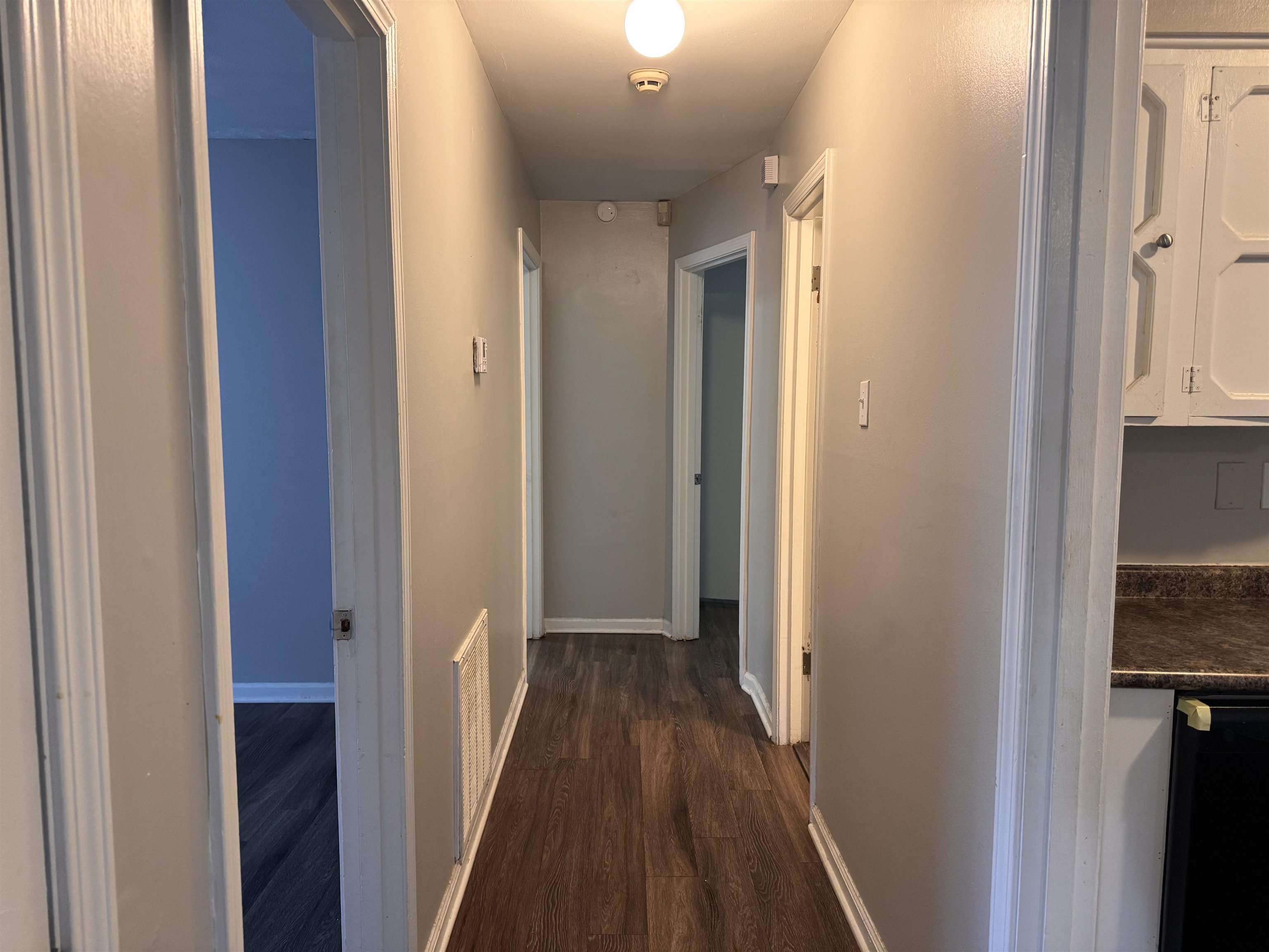 3788 Bishops Bridge Road Memphis, TN 38118 - Photo 10 of 22 a view of a hallway with wooden floor and staircase