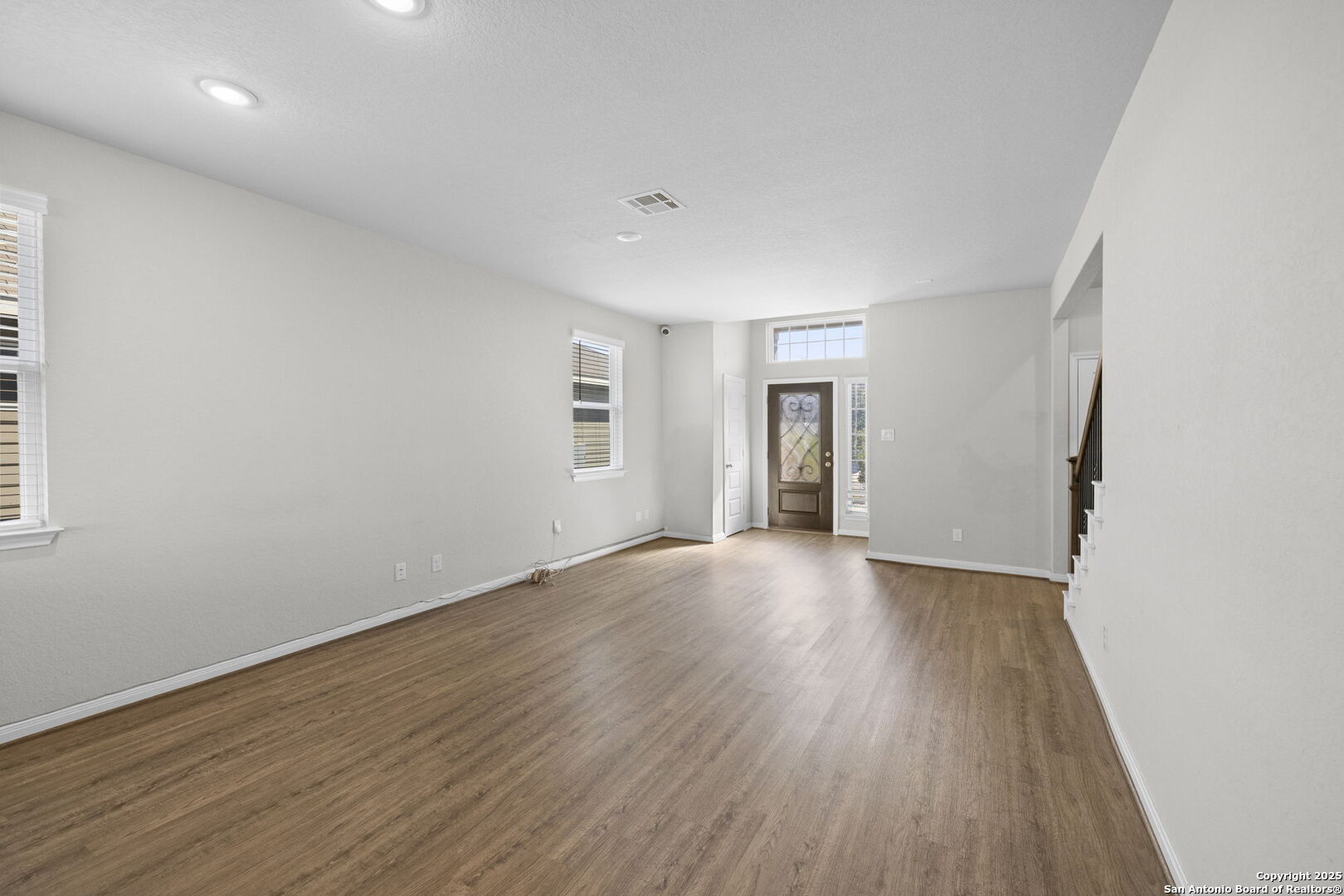 5139 Longhorn Converse, TX 78109 - Photo 11 of 46 an empty room with wooden floor and windows
