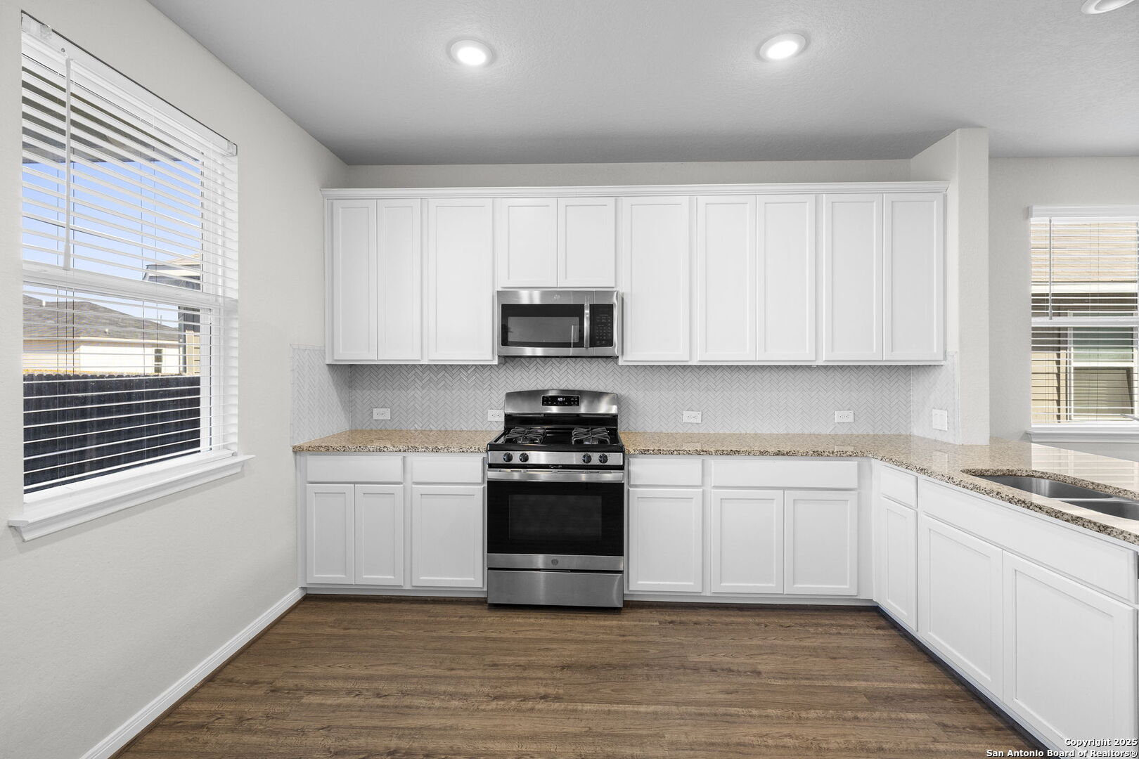 5139 Longhorn Converse, TX 78109 - Photo 13 of 46 a kitchen with stainless steel appliances granite countertop a stove and a sink