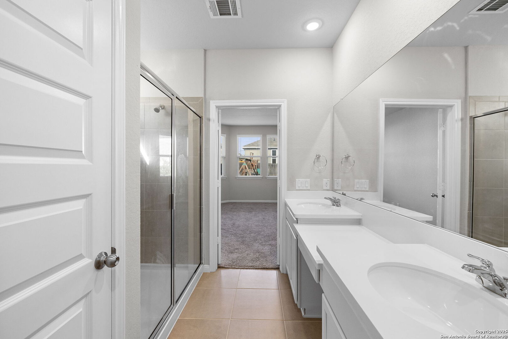 5139 Longhorn Converse, TX 78109 - Photo 23 of 46 a bathroom with a double vanity sink and mirror