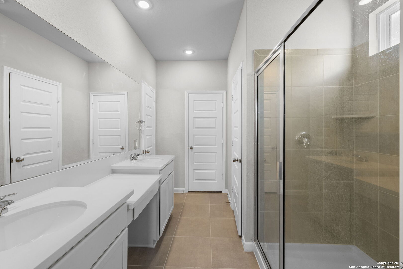 5139 Longhorn Converse, TX 78109 - Photo 25 of 46 a bathroom with a double vanity sink mirror double and shower