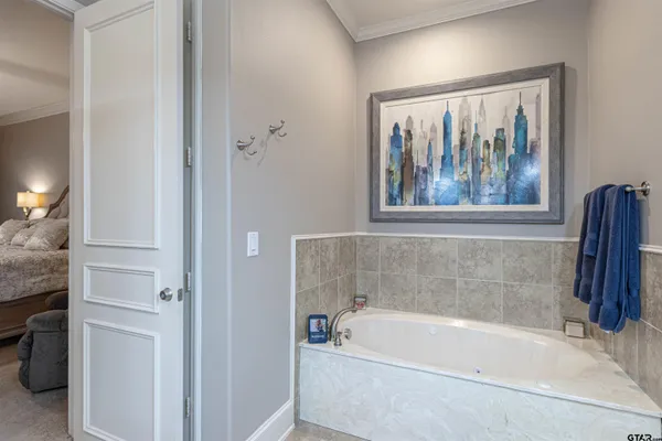 a white bath tub sitting next to a window