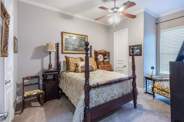 a bed room with a bed and a chandelier