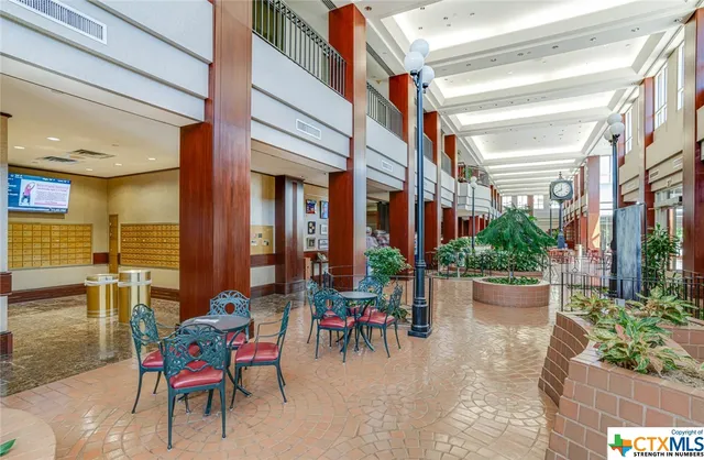 a view of a dinning tables and chairs in a patio