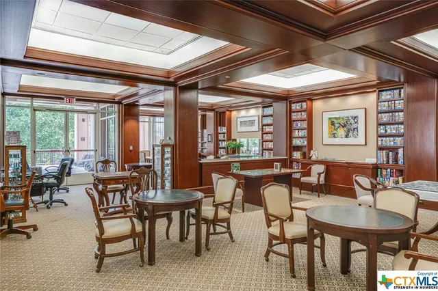 a view of living room and shelves