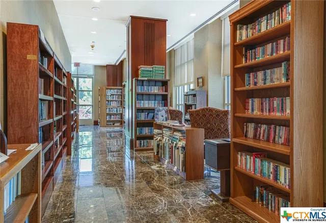 a room with furniture a wooden floor and a sink