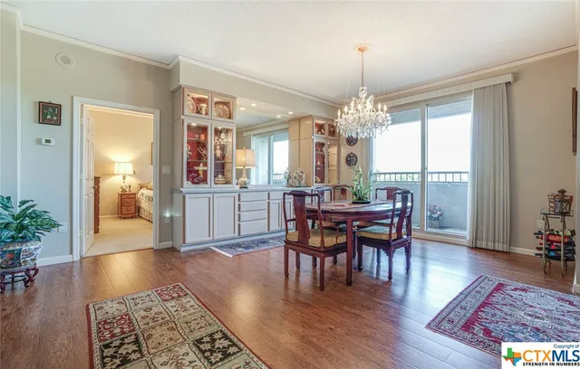 a view of a dining room with furniture and wooden floor