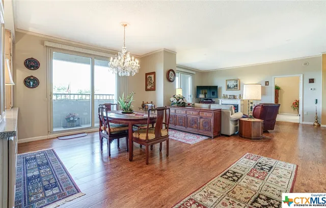 a view of a livingroom with furniture window and wooden floor