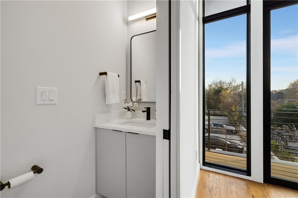 105 Georgia Avenue Southeast, Unit 1 Atlanta, GA 30312 - Photo 12 of 40 a bathroom with a shower and a sink