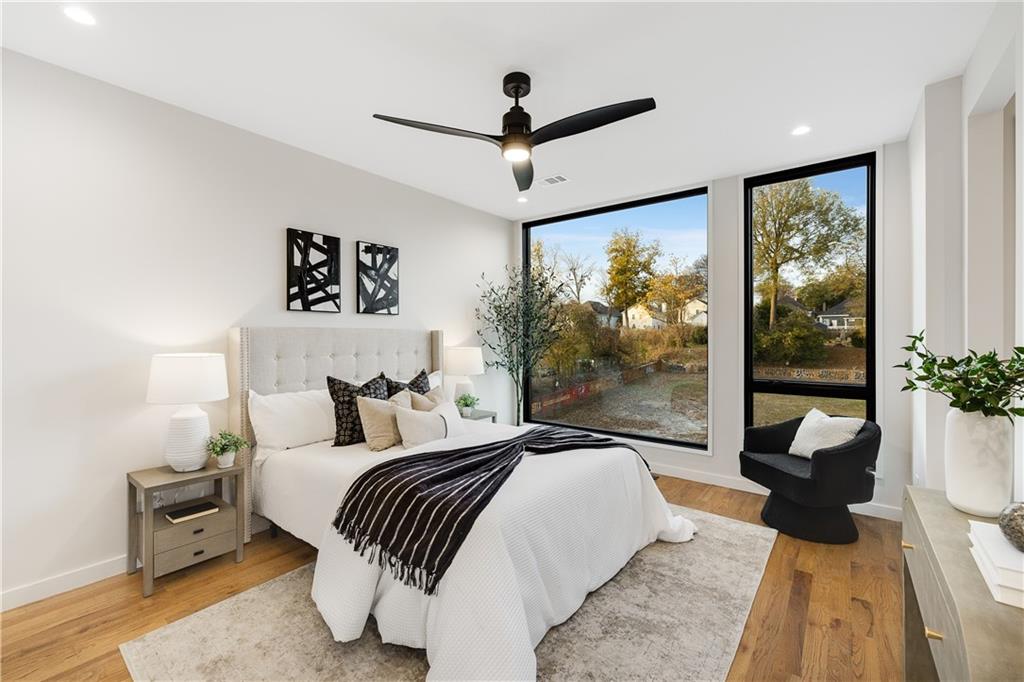 105 Georgia Avenue Southeast, Unit 1 Atlanta, GA 30312 - Photo 14 of 40 a bedroom with a large bed and a window