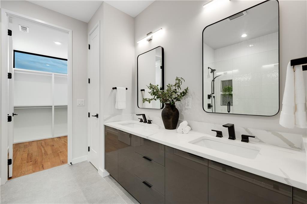 105 Georgia Avenue Southeast, Unit 1 Atlanta, GA 30312 - Photo 17 of 40 a bathroom with a double vanity sink mirror and double
