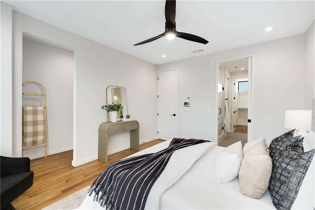 105 Georgia Avenue Southeast, Unit 1 Atlanta, GA 30312 - Photo 19 of 40 a bedroom with a bed and wooden floor