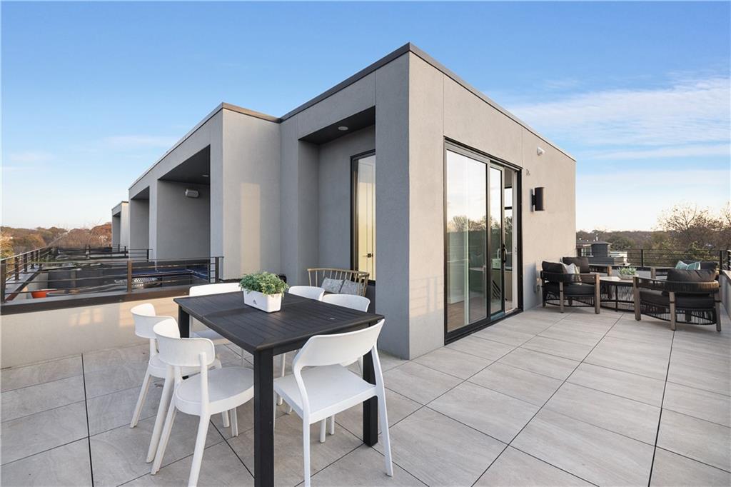 105 Georgia Avenue Southeast, Unit 1 Atlanta, GA 30312 - Photo 2 of 40 a view of dinning table and chairs in the patio