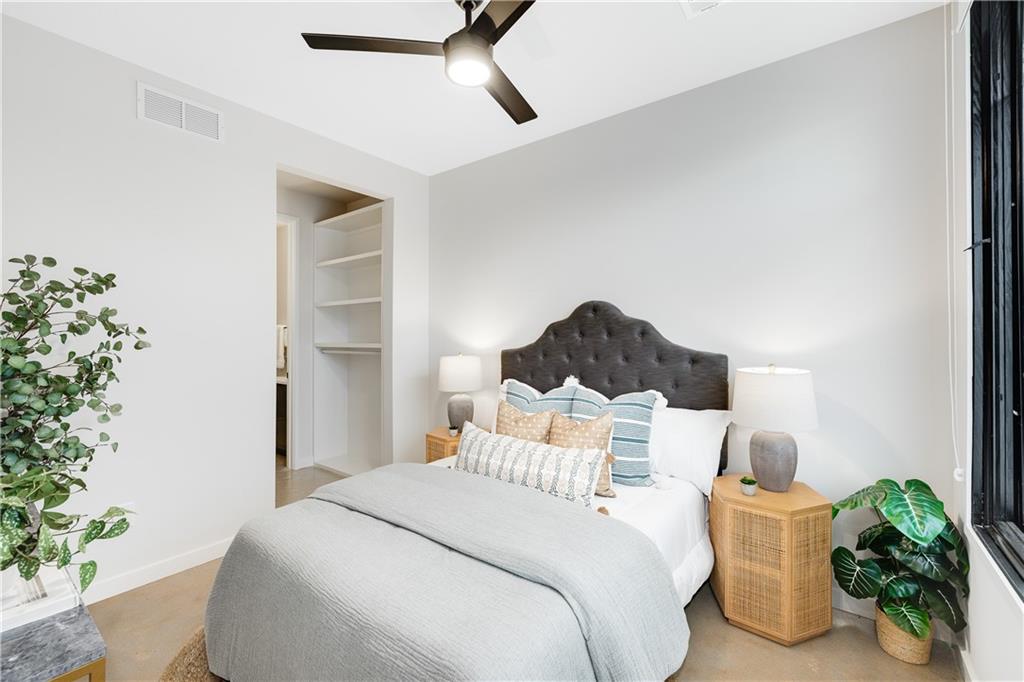 105 Georgia Avenue Southeast, Unit 1 Atlanta, GA 30312 - Photo 21 of 40 a bedroom with a bed and a potted plant