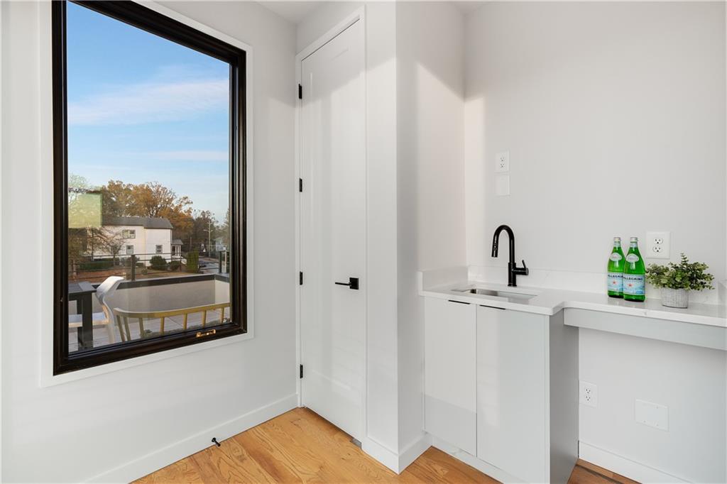 105 Georgia Avenue Southeast, Unit 1 Atlanta, GA 30312 - Photo 24 of 40 a view of a bathroom with a sink and mirror