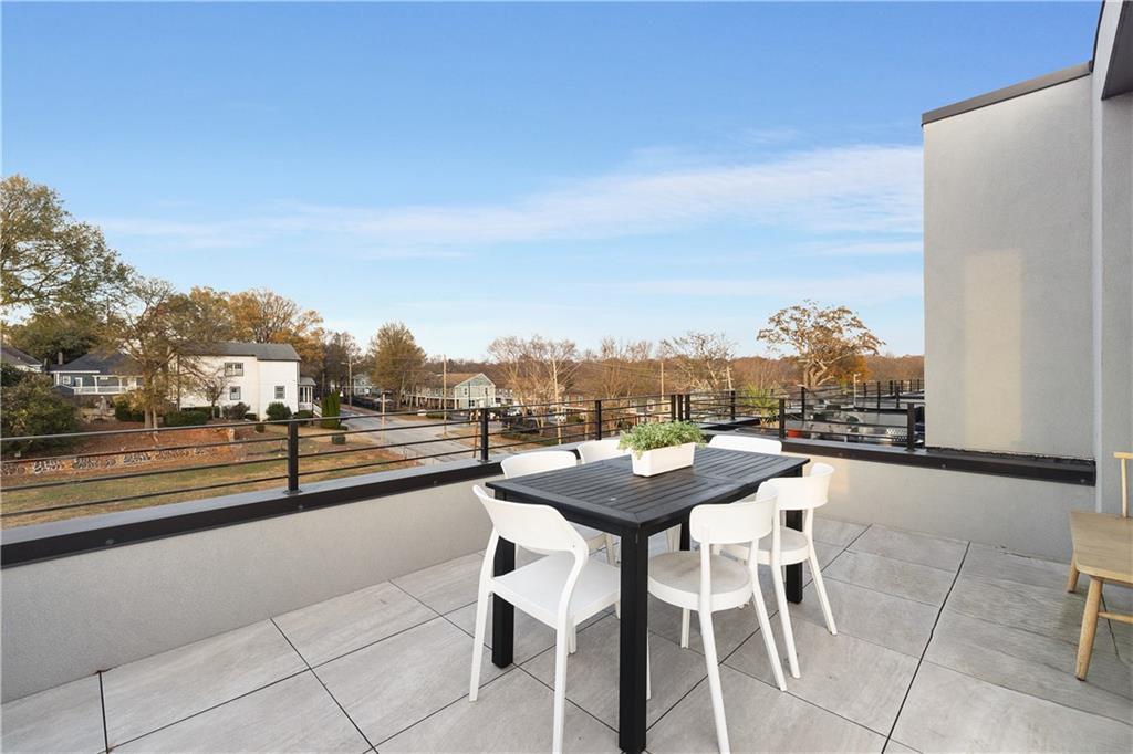 105 Georgia Avenue Southeast, Unit 1 Atlanta, GA 30312 - Photo 26 of 40 a view of a terrace with furniture and city view