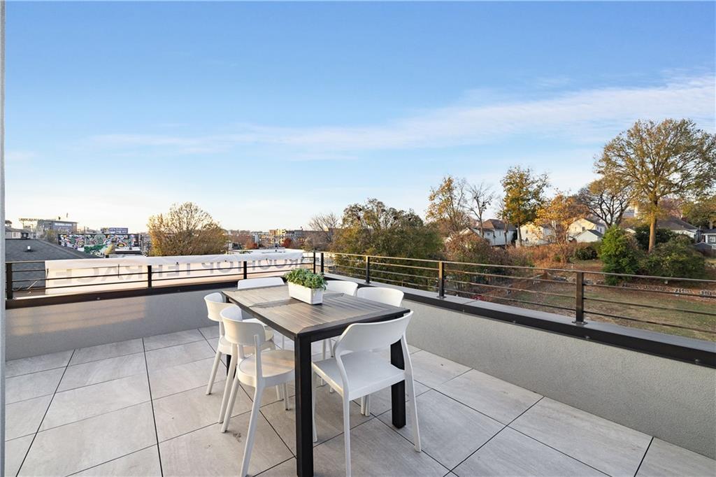 105 Georgia Avenue Southeast, Unit 1 Atlanta, GA 30312 - Photo 28 of 40 a view of a terrace with furniture and city view