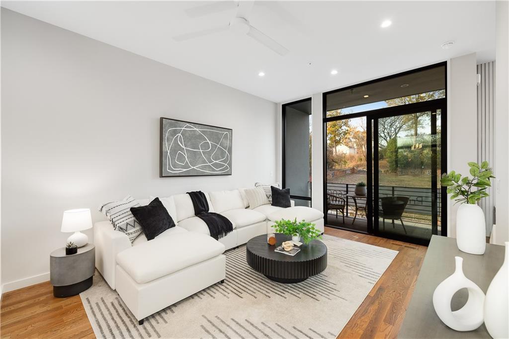105 Georgia Avenue Southeast, Unit 1 Atlanta, GA 30312 - Photo 7 of 40 a living room with furniture and a potted plant