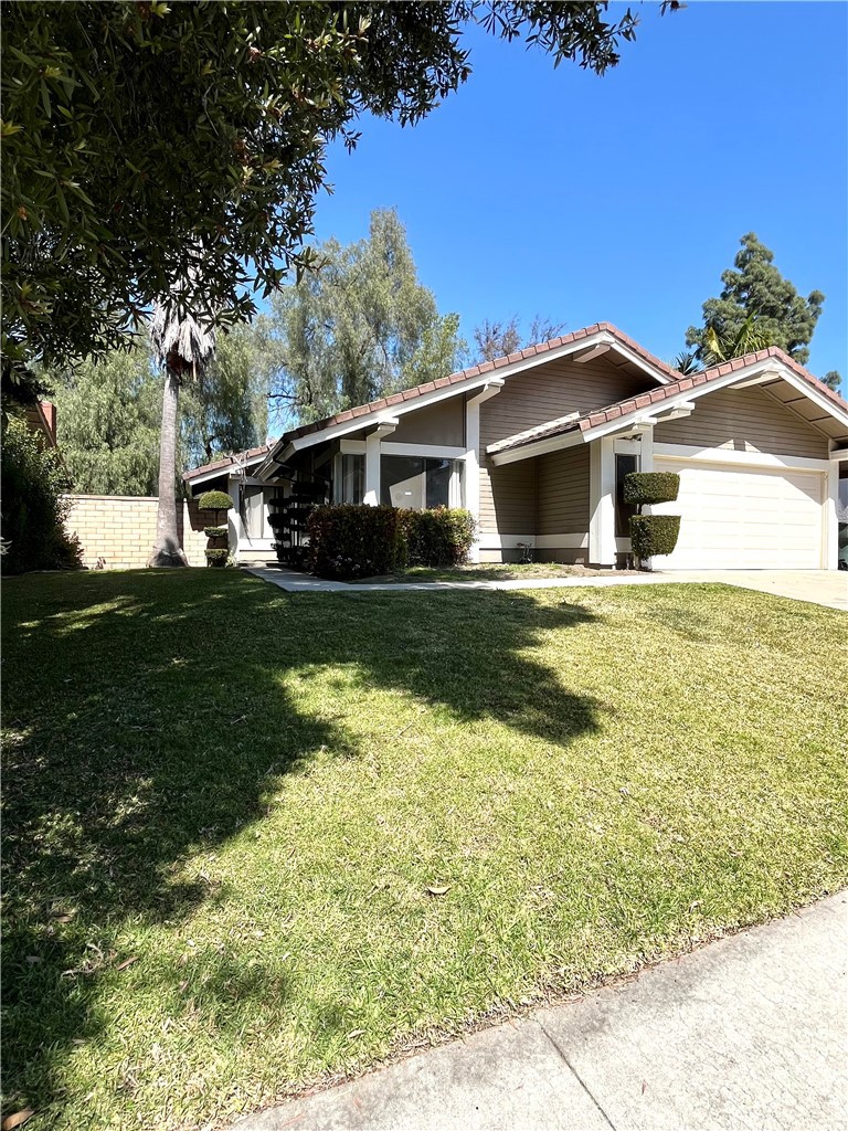 a front view of a house with yard