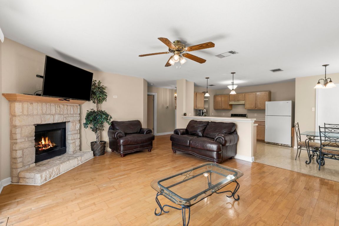 141 Sydney's Way Buda, TX 78610 - Photo 15 of 37 a living room with furniture and a fireplace