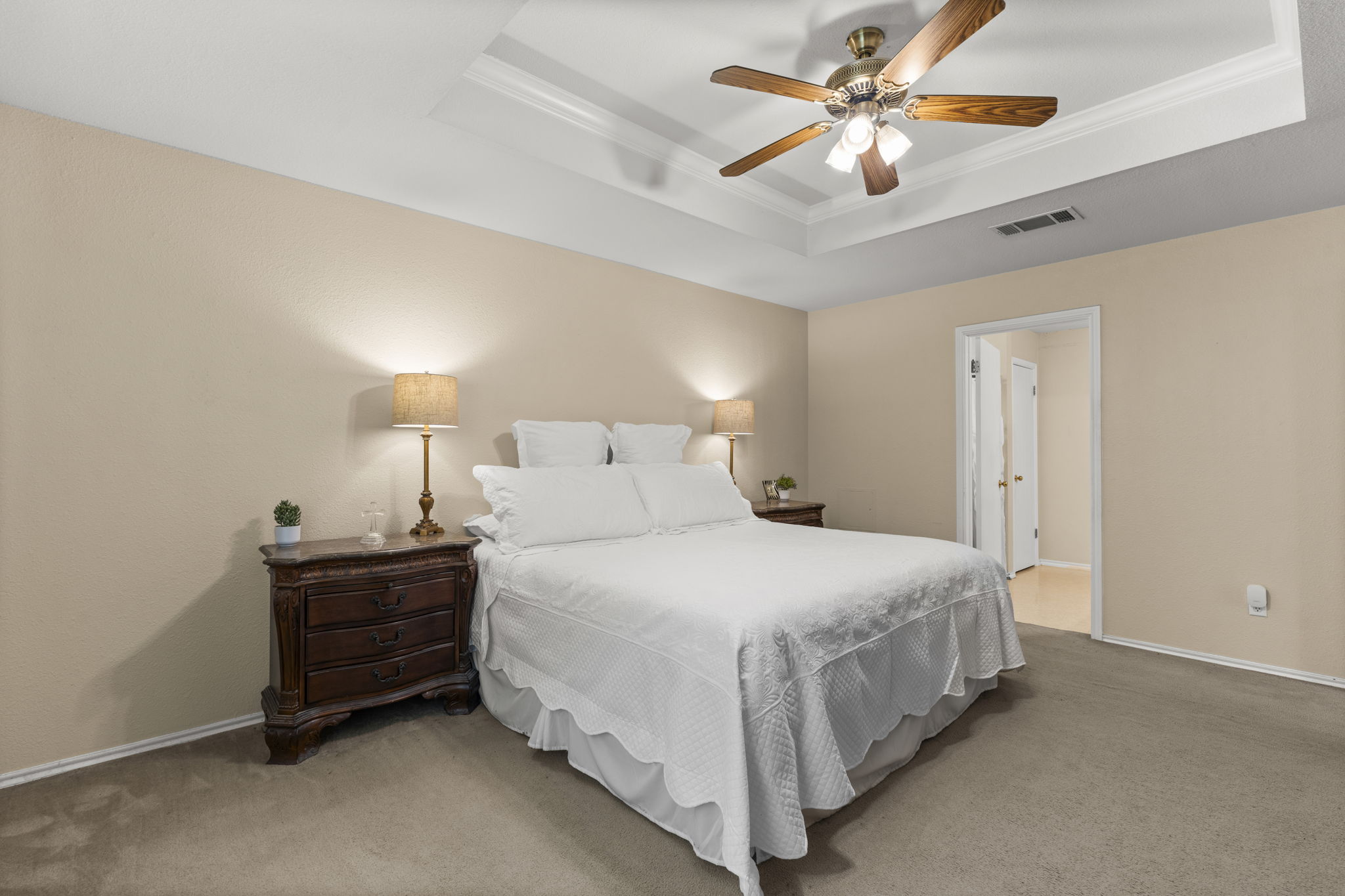 141 Sydney's Way Buda, TX 78610 - Photo 18 of 37 a bedroom with a bed and a chandelier