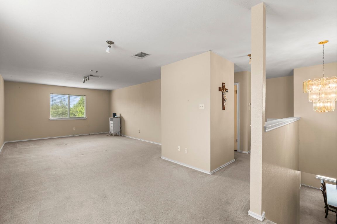 141 Sydney's Way Buda, TX 78610 - Photo 20 of 37 a view of an empty room with a window