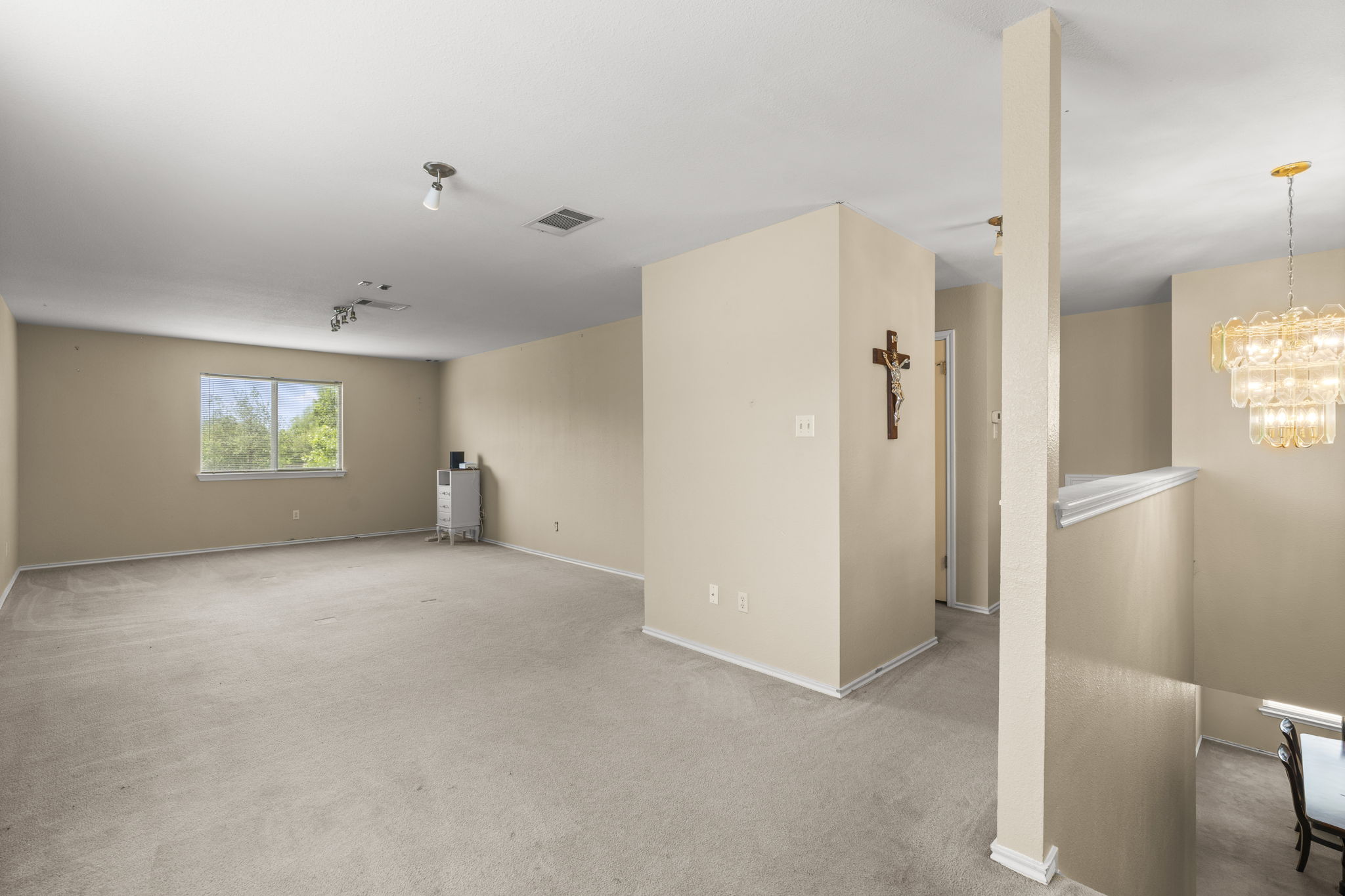 141 Sydney's Way Buda, TX 78610 - Photo 20 of 37 a view of an empty room with a window