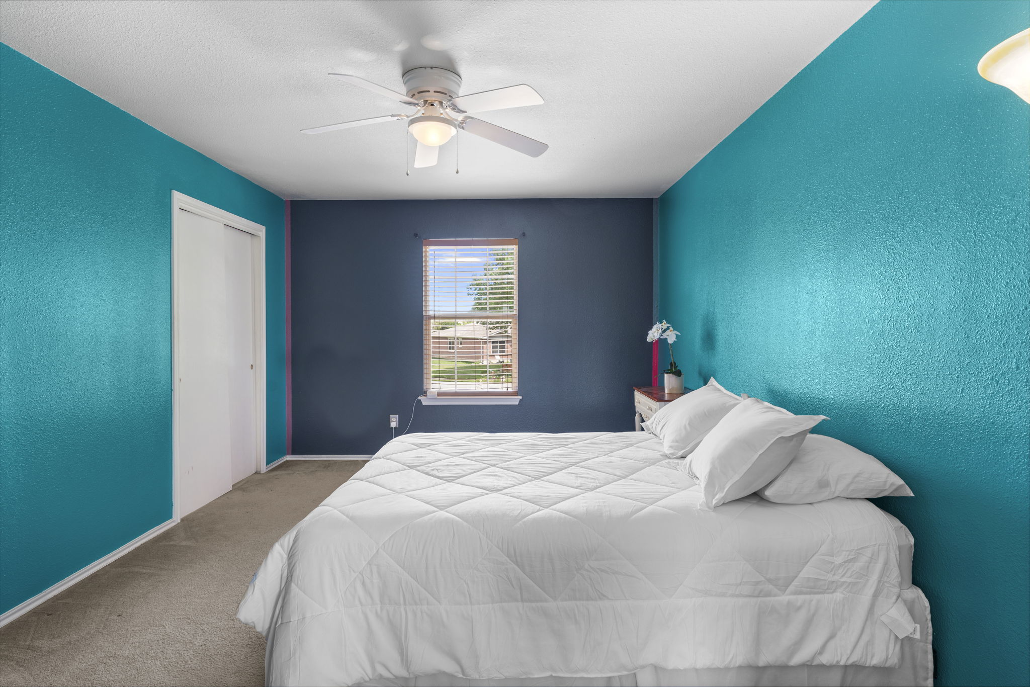 141 Sydney's Way Buda, TX 78610 - Photo 21 of 37 a bedroom with a bed and a chandelier