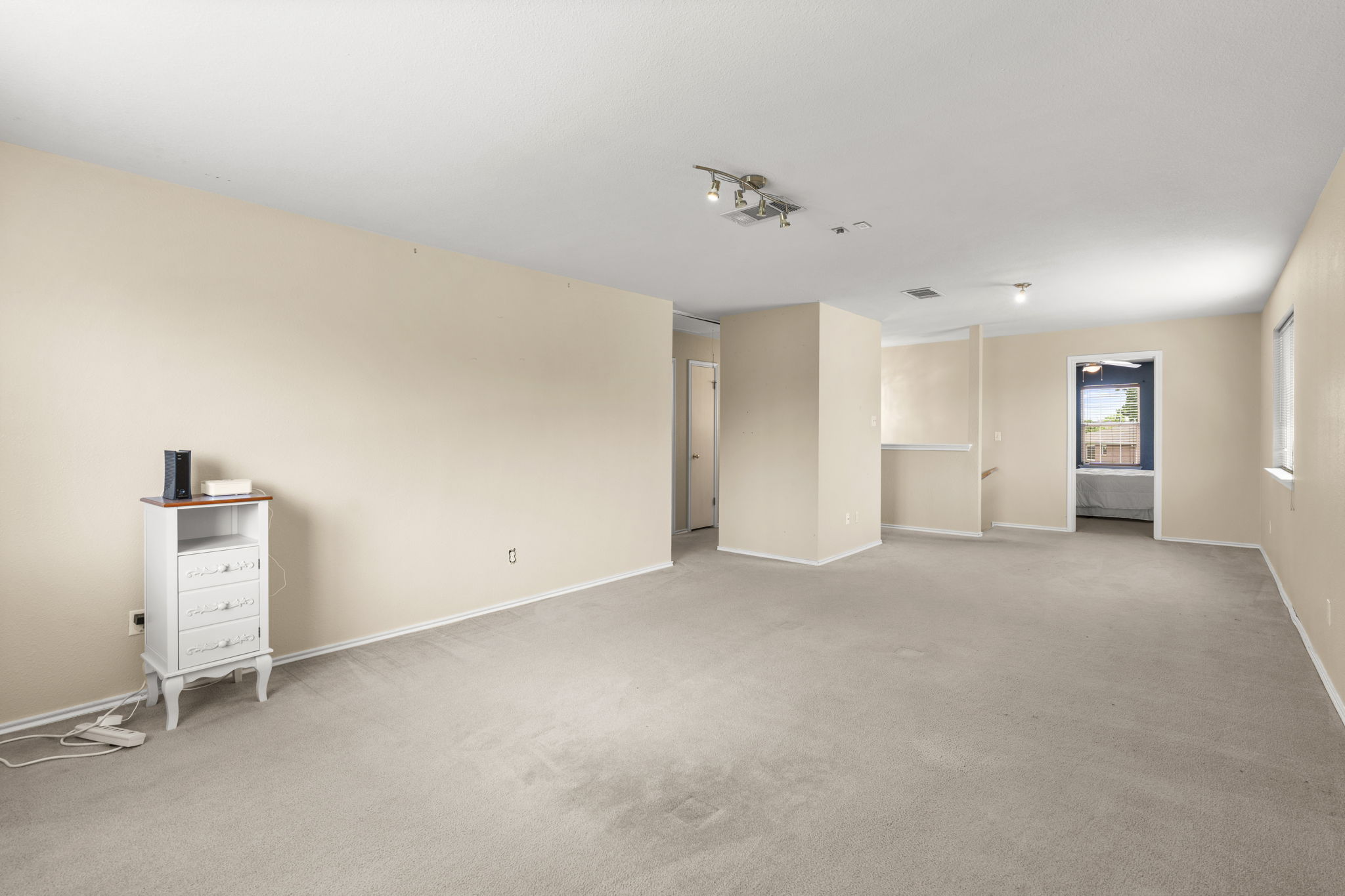 141 Sydney's Way Buda, TX 78610 - Photo 23 of 37 an empty room with a empty space and windows