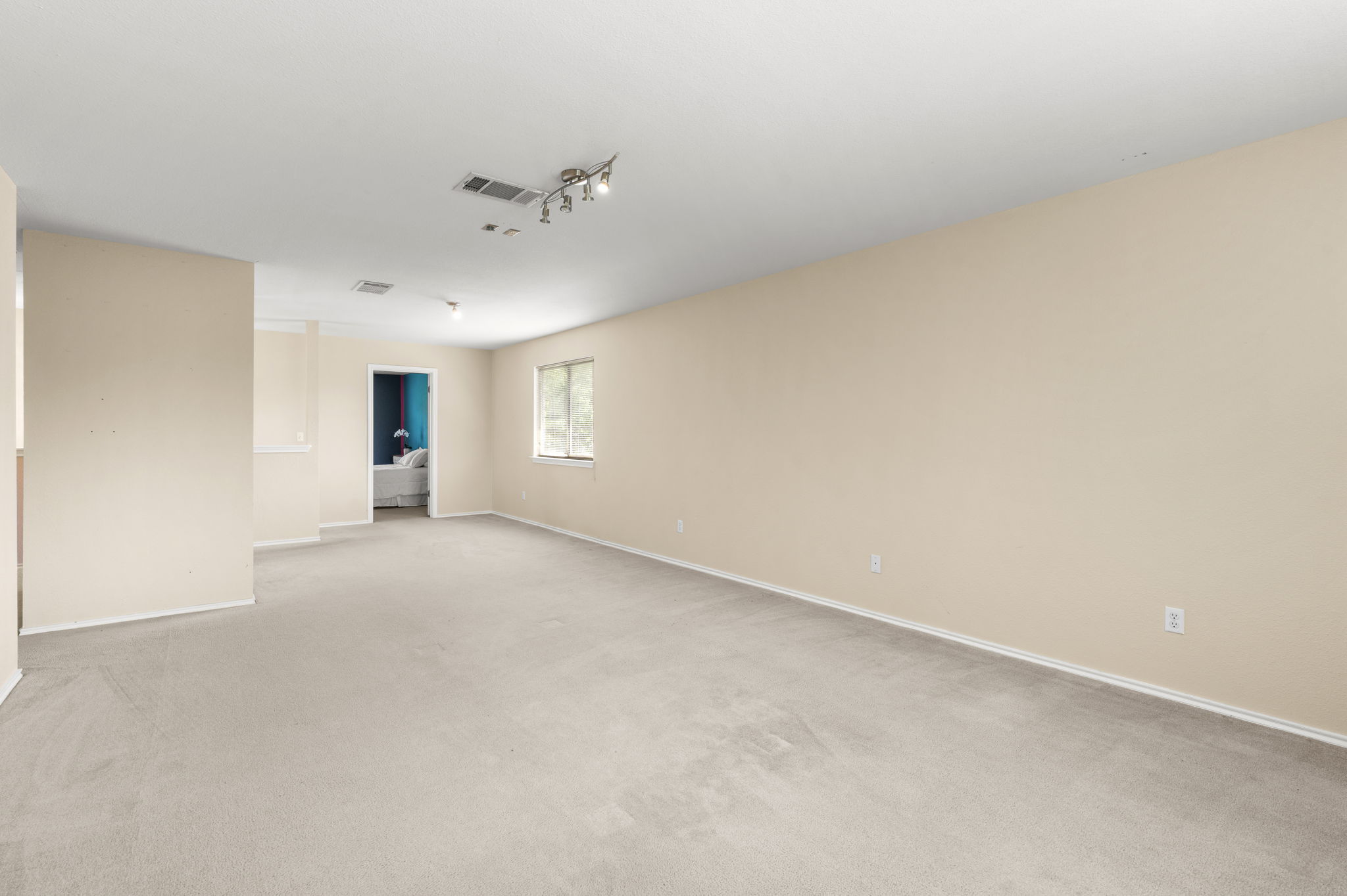 141 Sydney's Way Buda, TX 78610 - Photo 24 of 37 a view of an empty room with a window