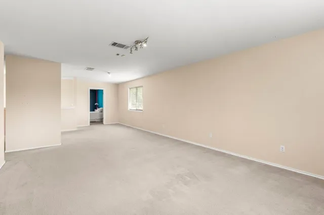 a view of an empty room with a window