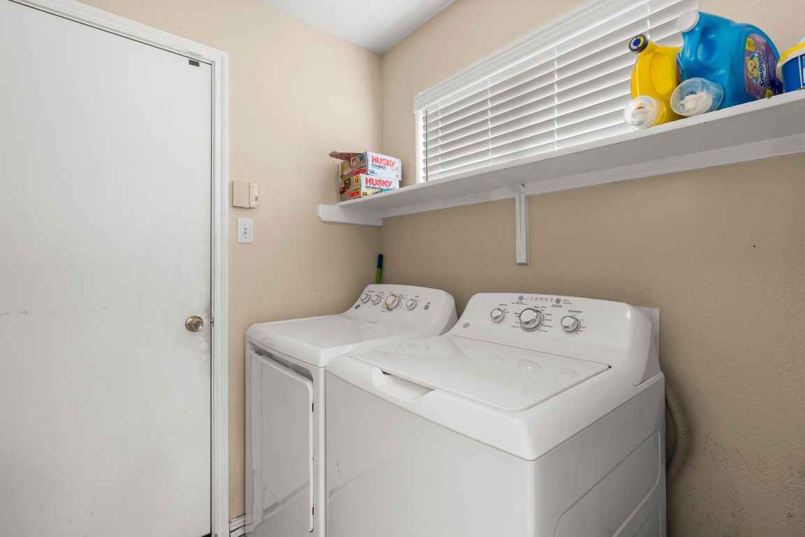 141 Sydney's Way Buda, TX 78610 - Photo 28 of 37 a utility room with dryer and washer