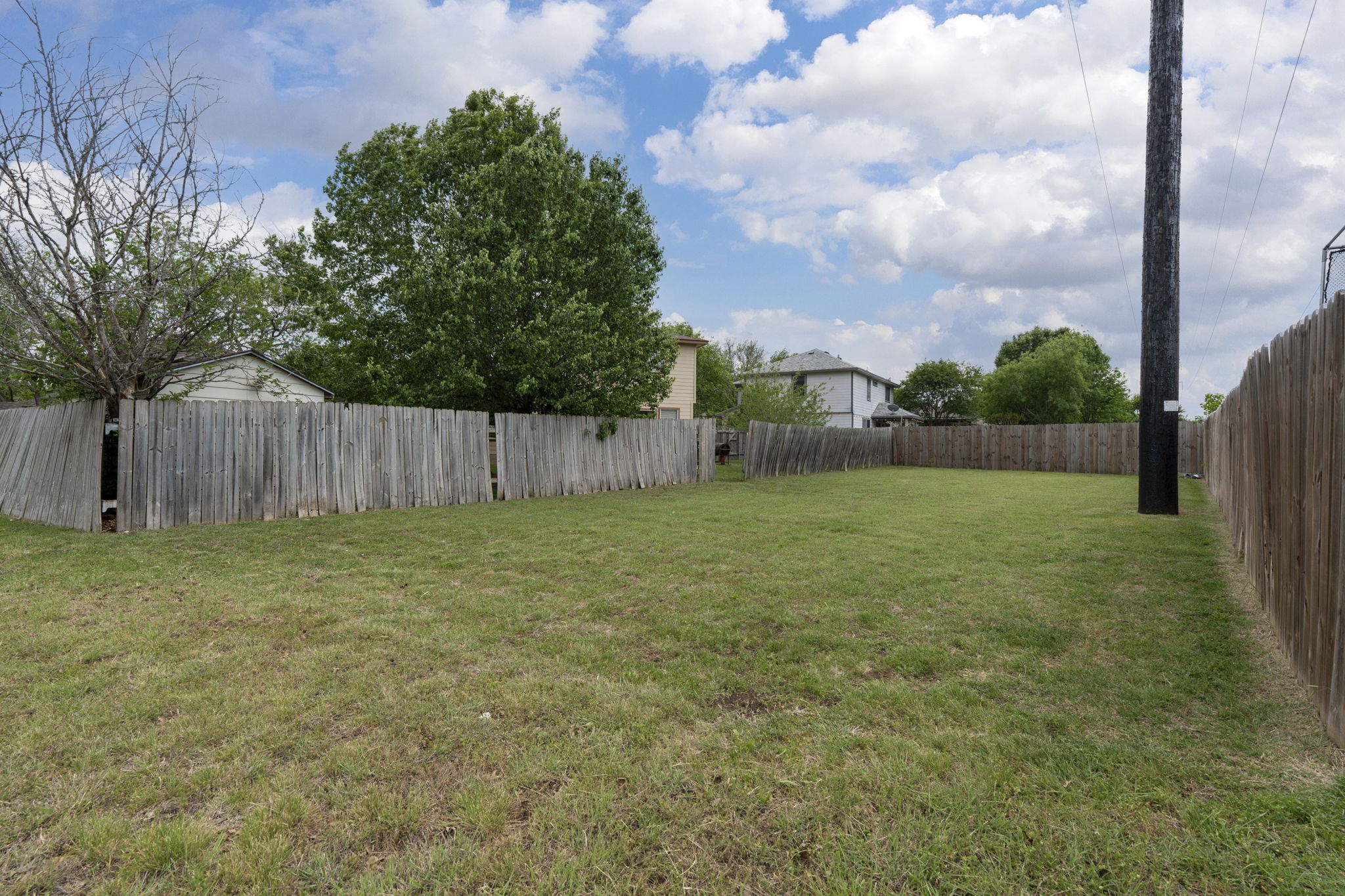 141 Sydney's Way Buda, TX 78610 - Photo 29 of 37 a backyard of a house
