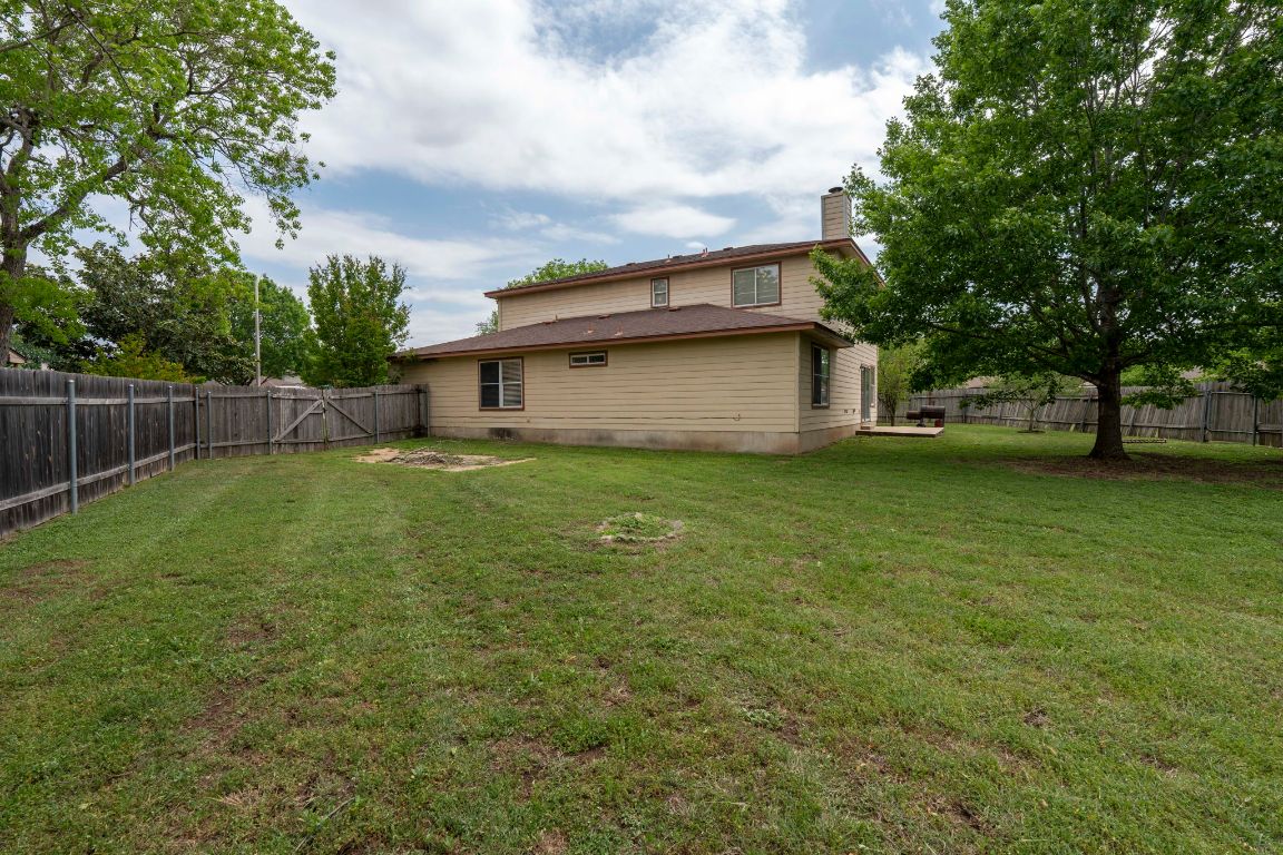 141 Sydney's Way Buda, TX 78610 - Photo 31 of 37 a view of a house with a yard