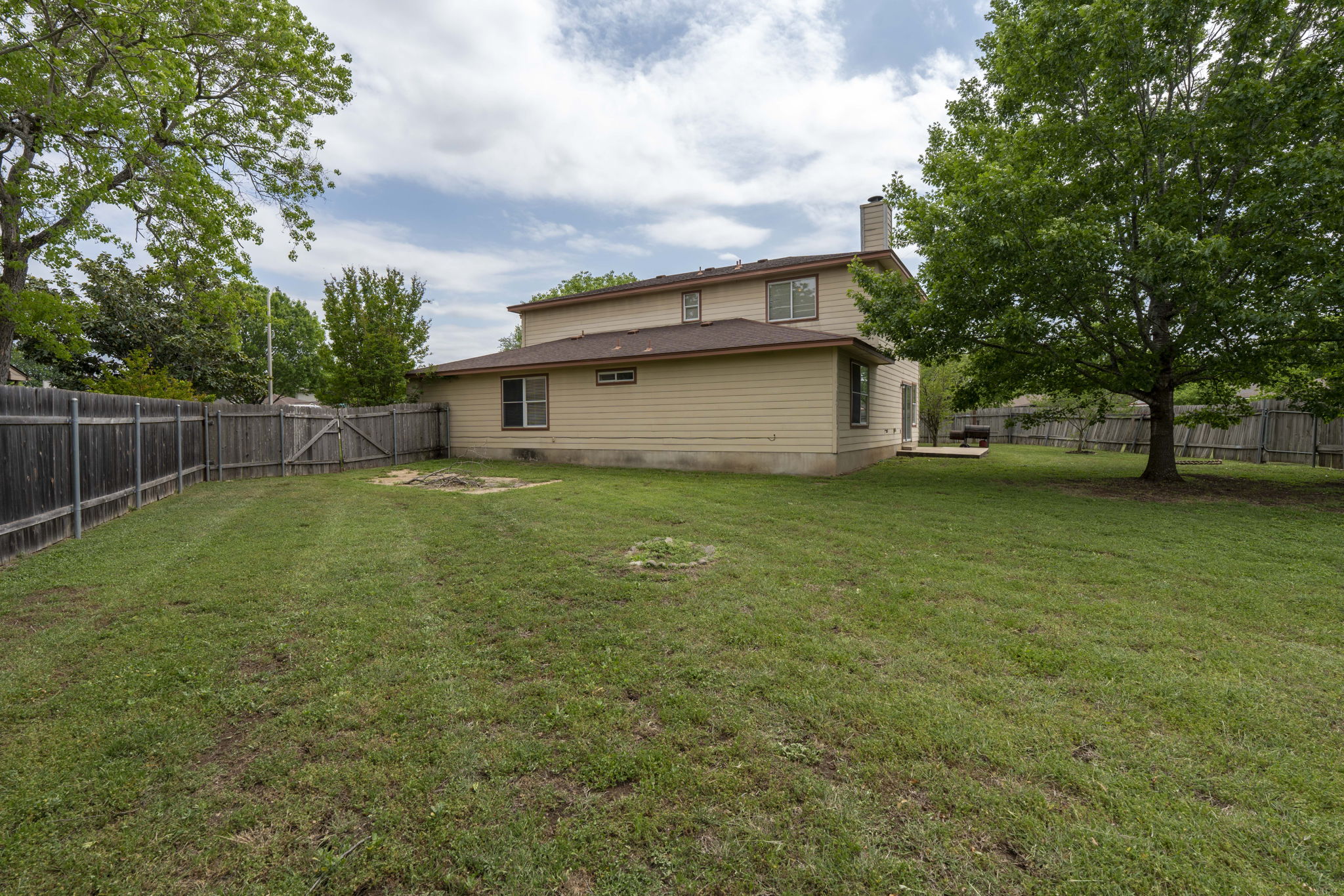 141 Sydney's Way Buda, TX 78610 - Photo 31 of 37 a view of a house with a yard