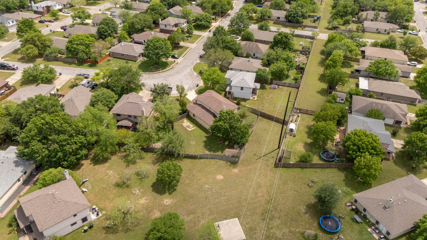 141 Sydney's Way Buda, TX 78610 - Photo 35 of 37 an aerial view of residential houses with outdoor space