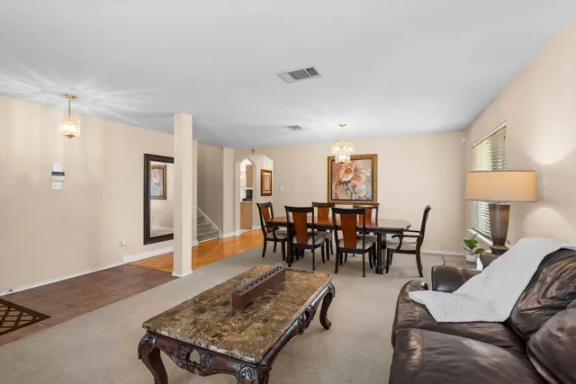 a living room with furniture and a table