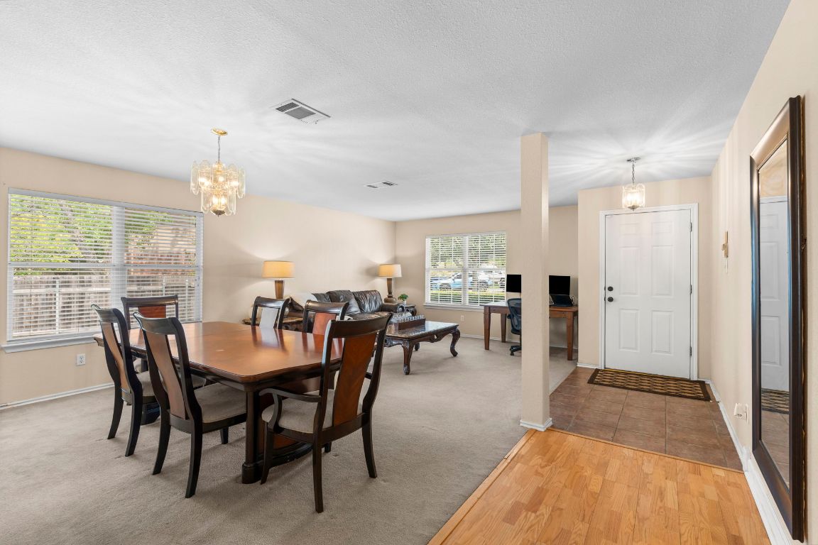 141 Sydney's Way Buda, TX 78610 - Photo 8 of 37 a view of a a dining room with furniture window and outside view