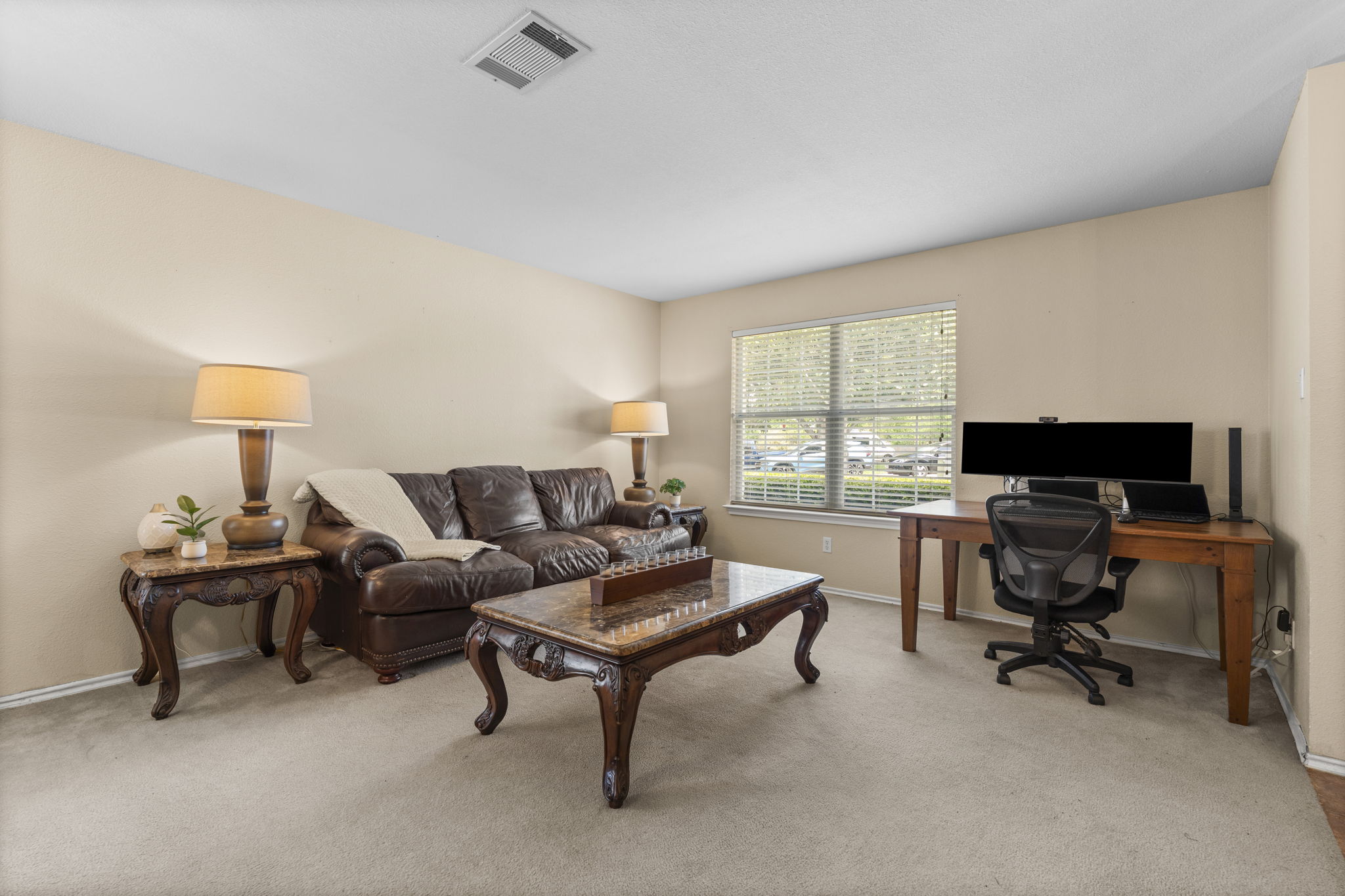 141 Sydney's Way Buda, TX 78610 - Photo 9 of 37 a living room with furniture a rug and a window