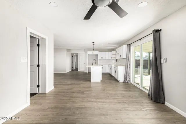 a view of kitchen with furniture and wooden floor