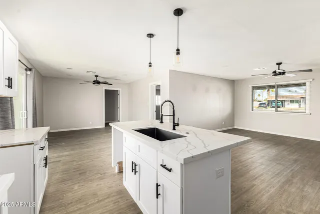 a view of a kitchen with sink and dishwasher