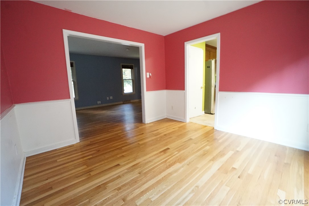 10110 Oldham Road Richmond, VA 23235 - Photo 13 of 26 a view of an empty room with wooden floor and a window