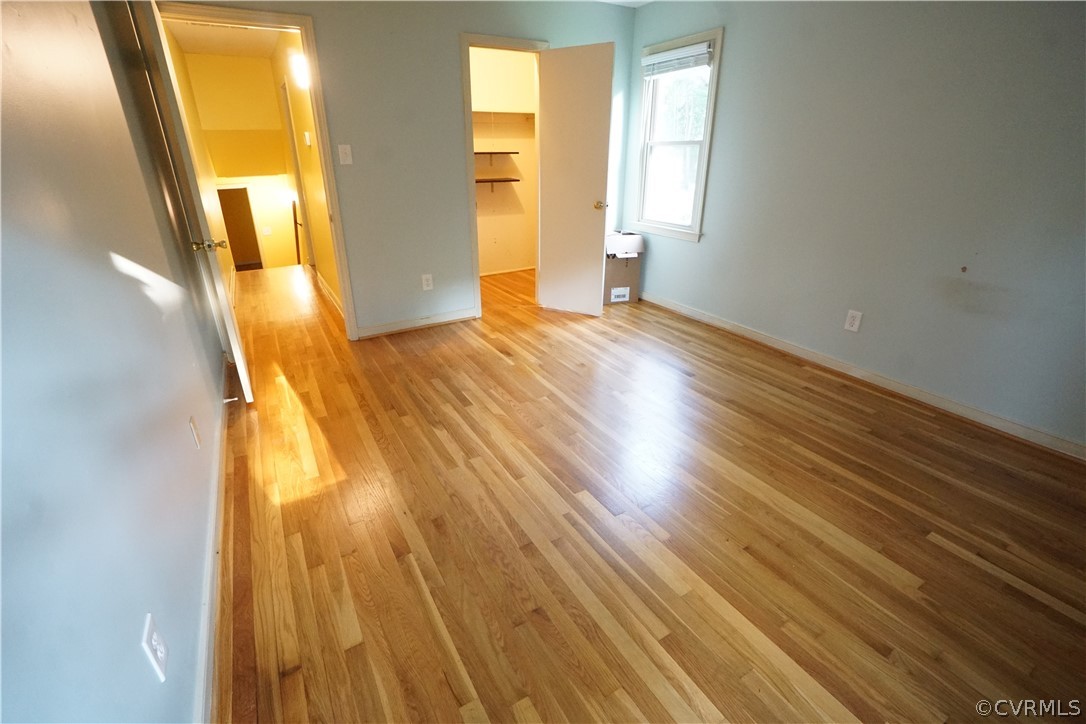 10110 Oldham Road Richmond, VA 23235 - Photo 23 of 26 a view of an empty room with wooden floor and a window